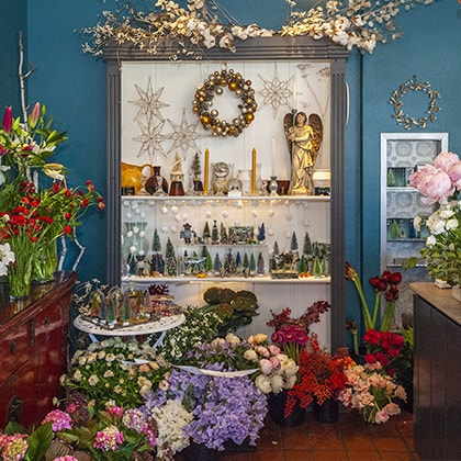 The Holidays at the flower shop were always filled with flowers and gifts thoughtfully displayed.